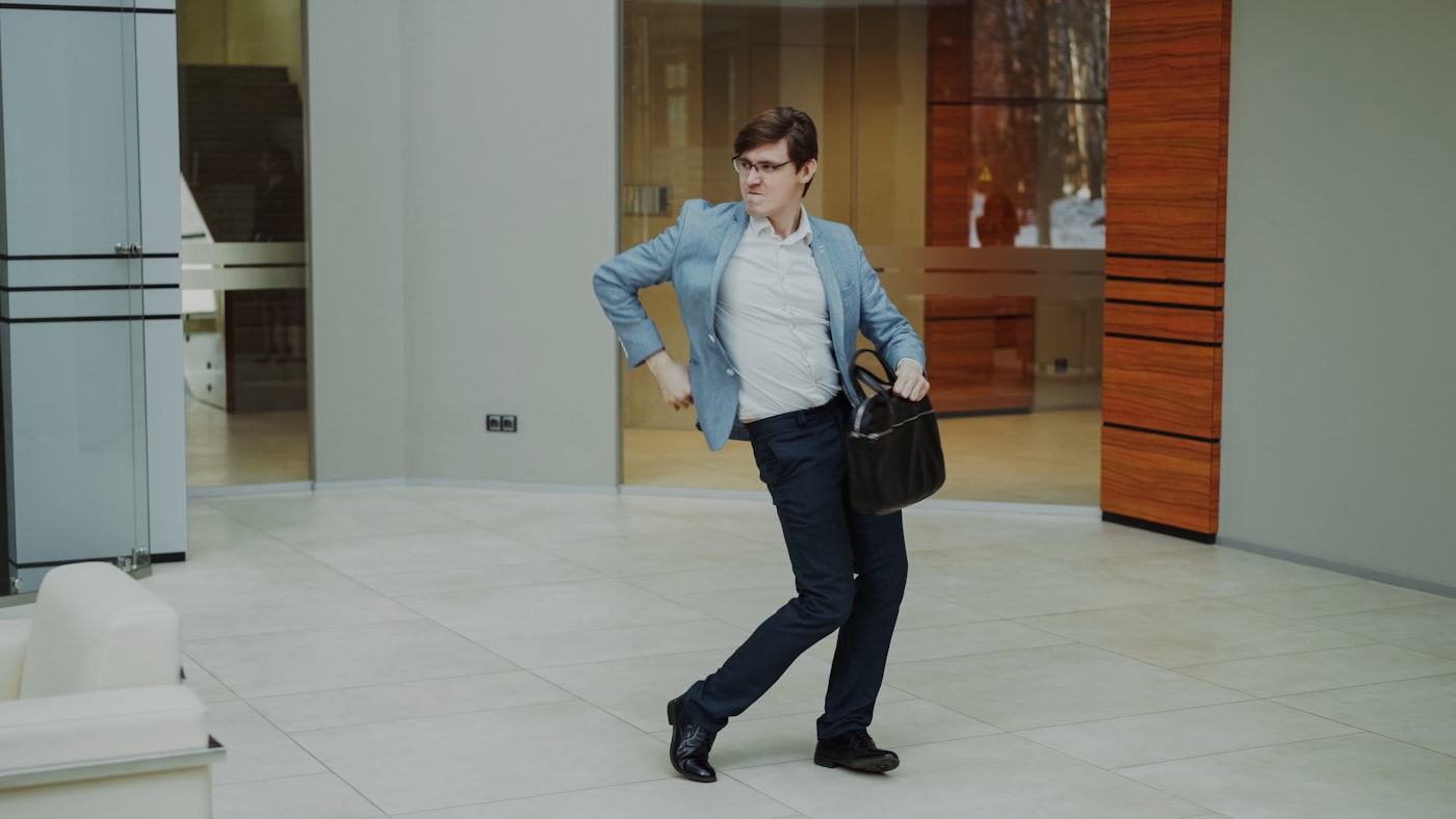 A man walking into a modern office
