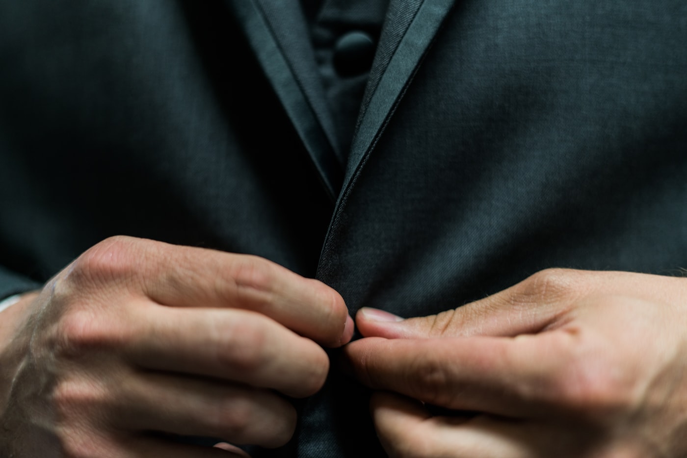 Buttoning a tailored jacket